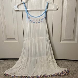 Girls white dress with blue fringe.